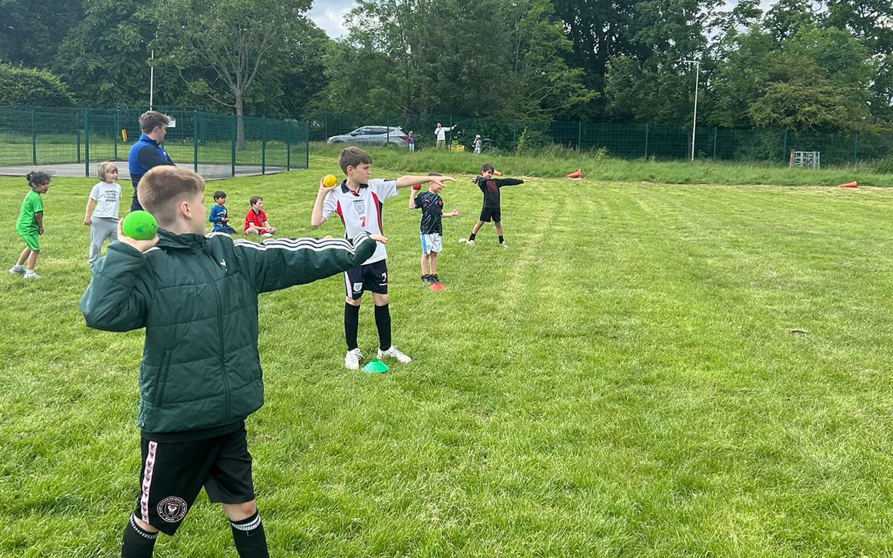 Children learning how to throw